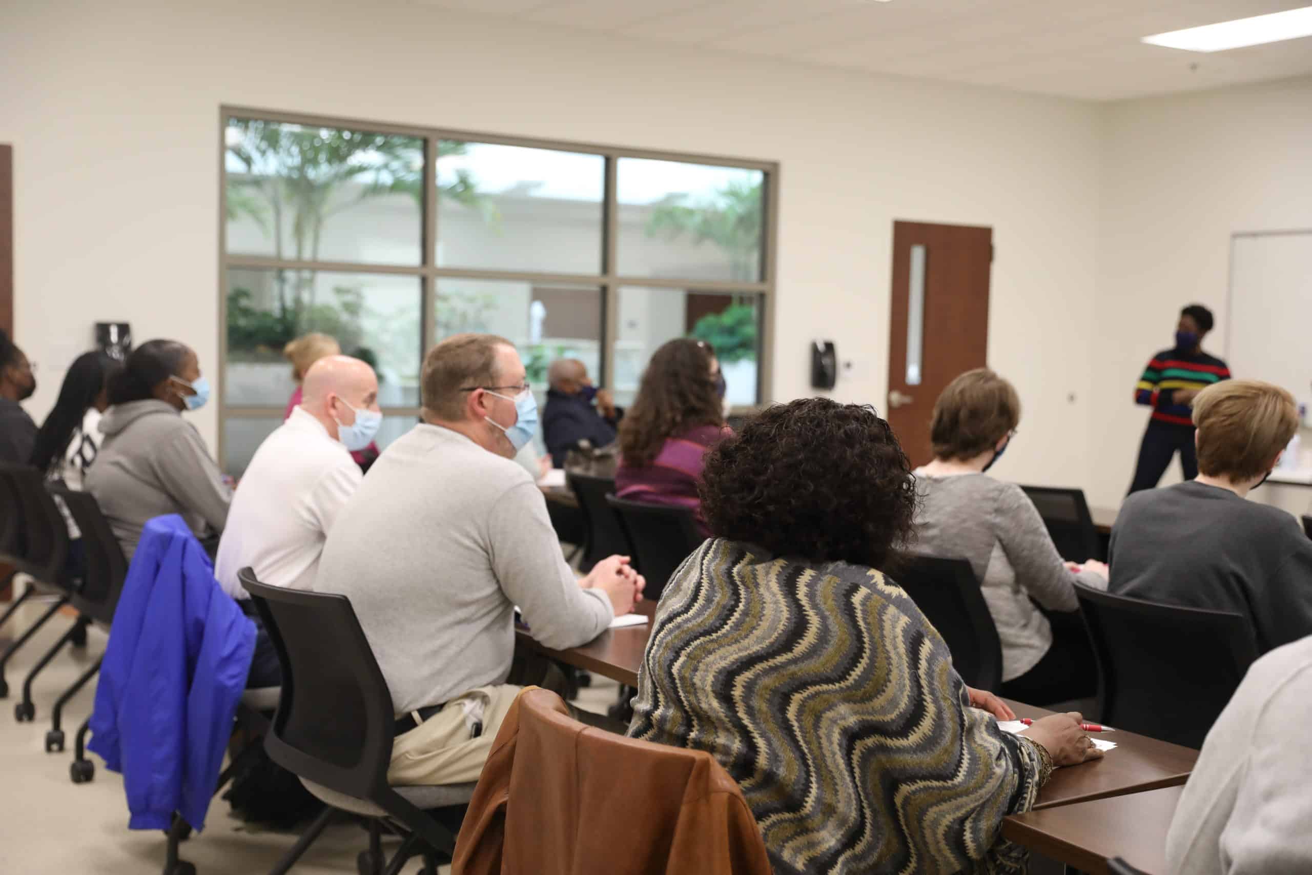 Students and faculty listen during a panel discussion.