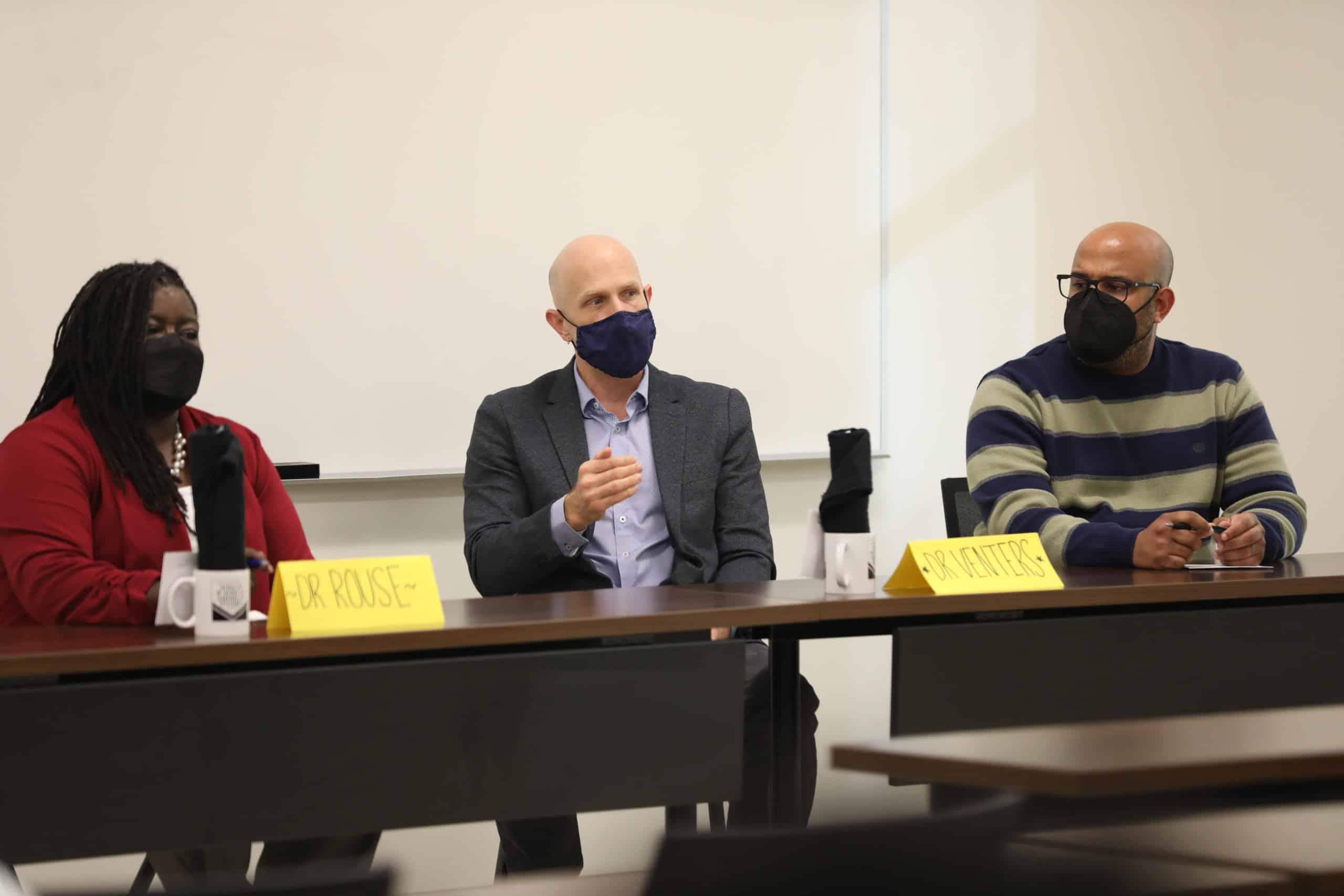 Panelists discuss.