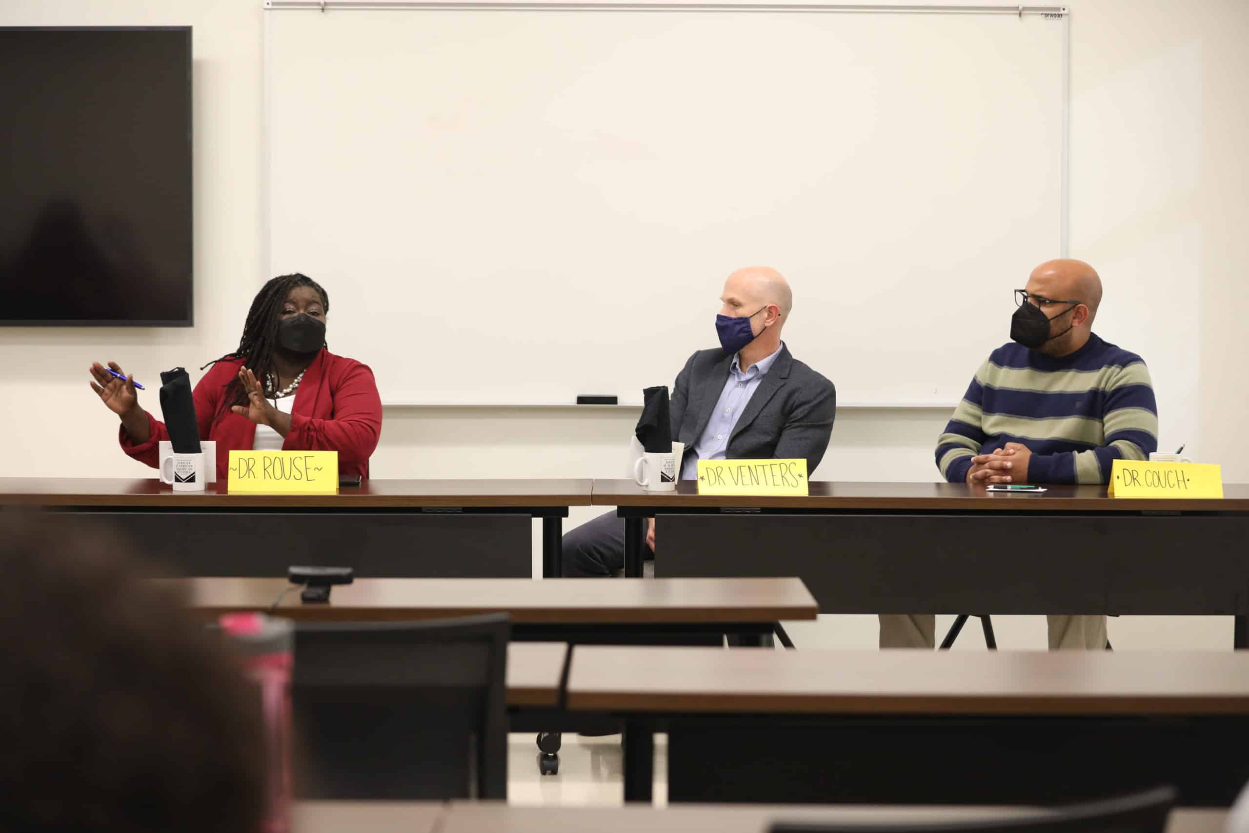 Panelists discuss.