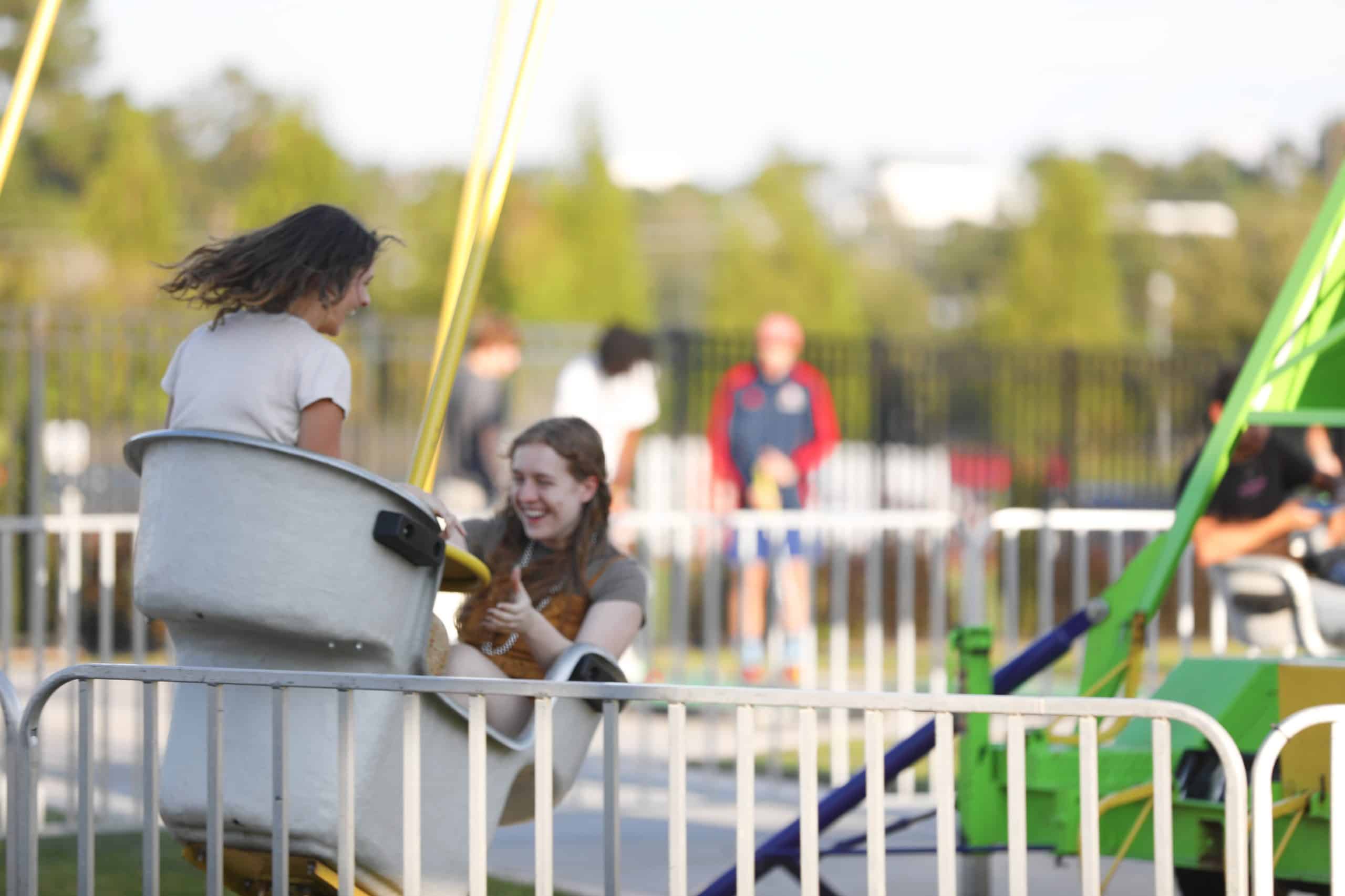 people spinning and smiling