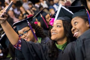 FMU graduates taking a photo at commencement