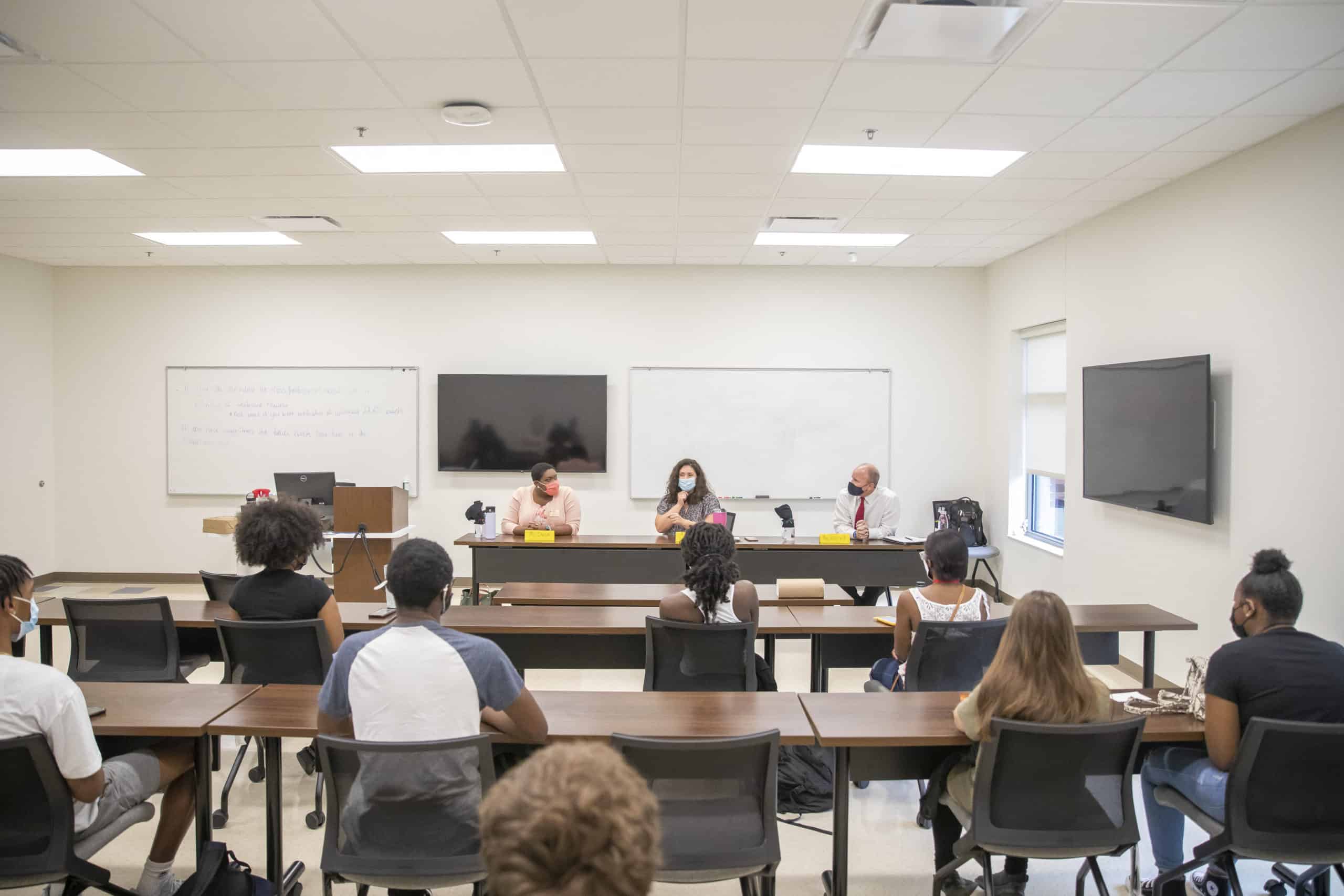 Students listen during a panel discussion.