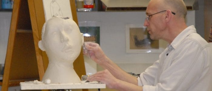 Man Sculpting in Fine Arts