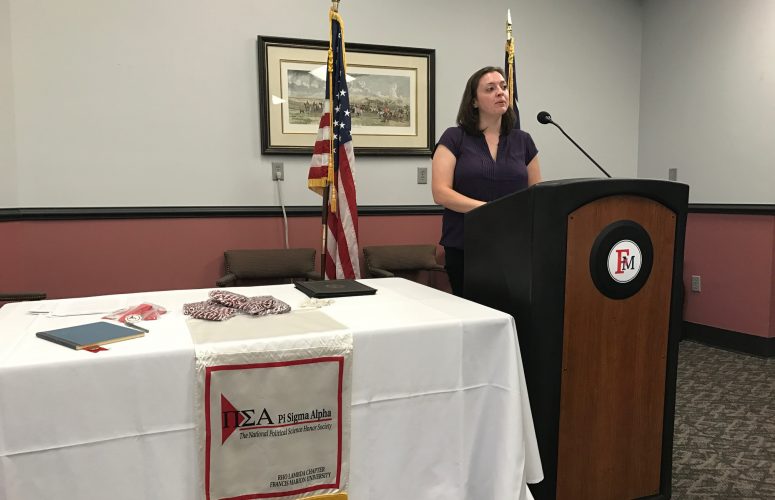 Professor Johnson speaking to Pi Sigma Alpha