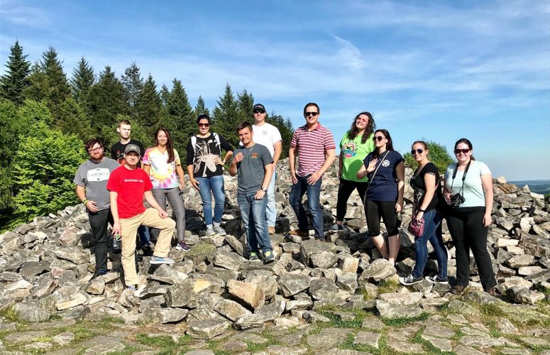 Political Science students standing on rocks in Germany