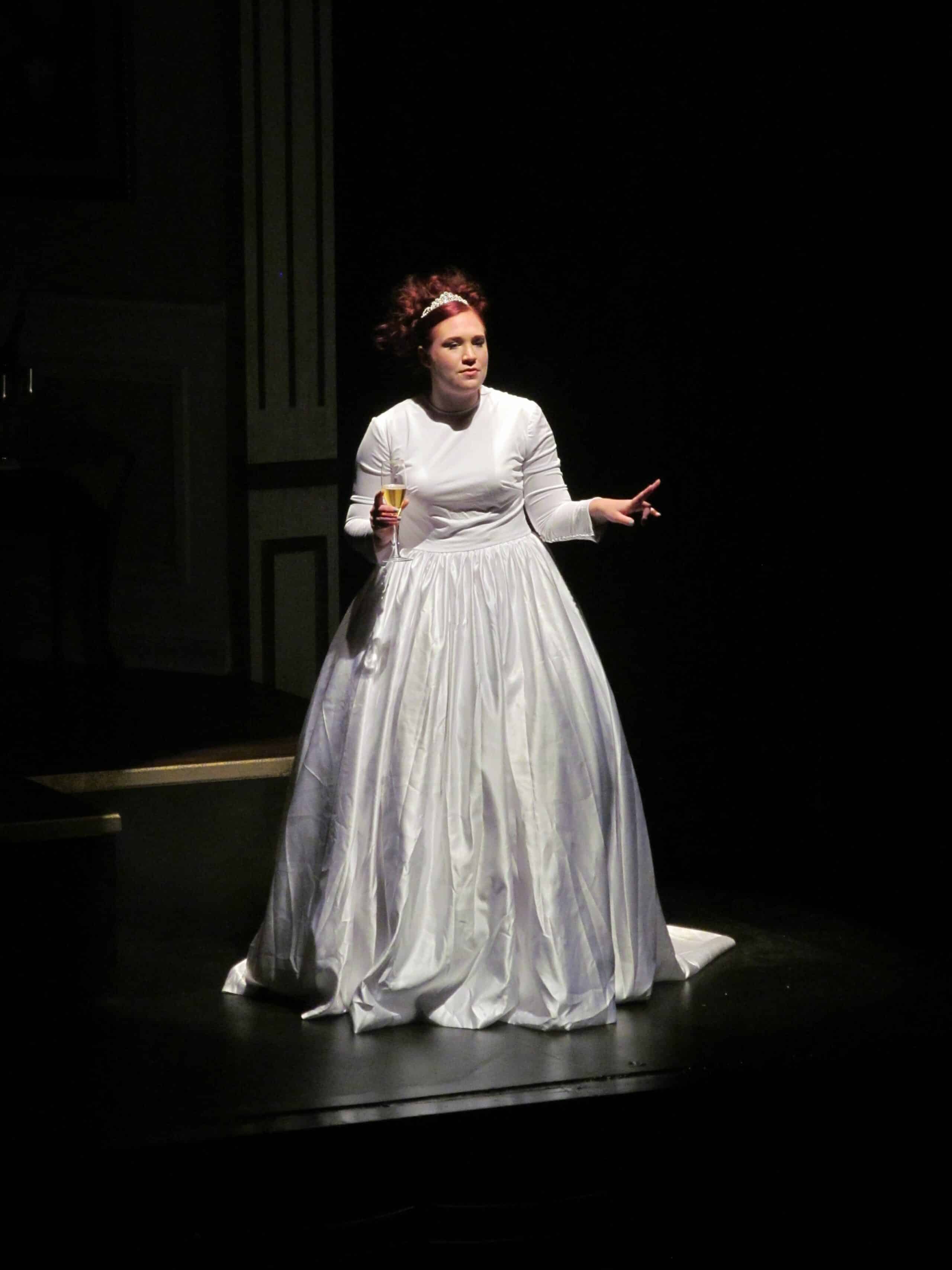 Women dressed in all white performing Bridesmaids