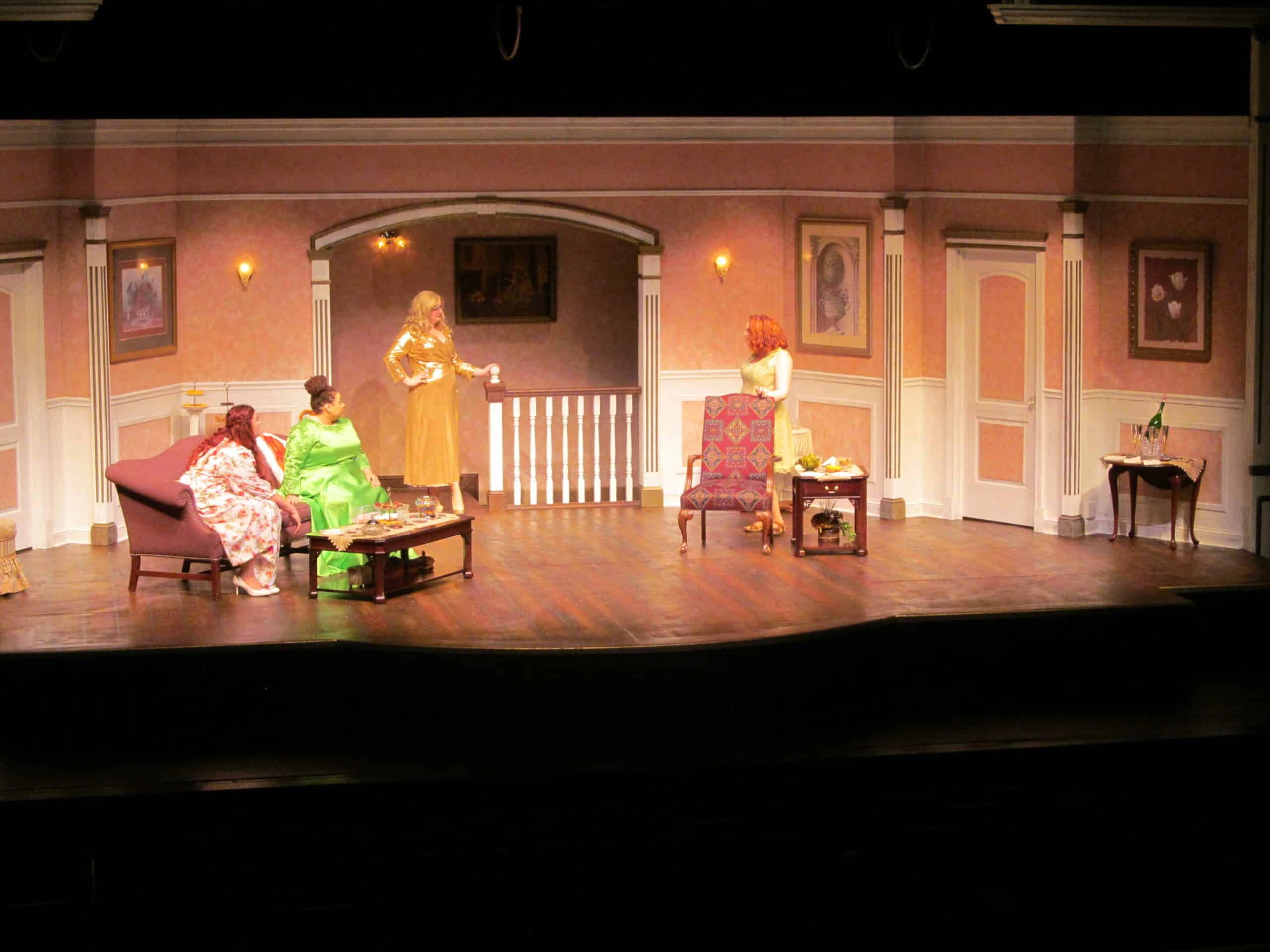 Four women on stage performing Bridesmaids