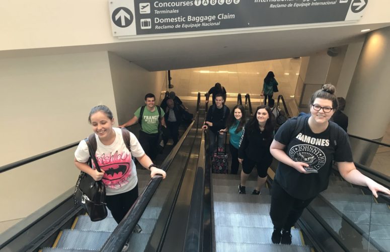 Students on the escalator in the ATL Airport