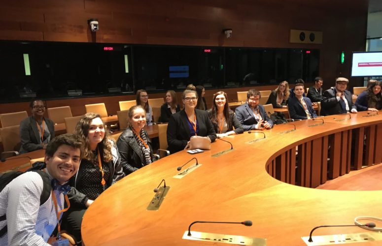 FMU students sitting at a round table