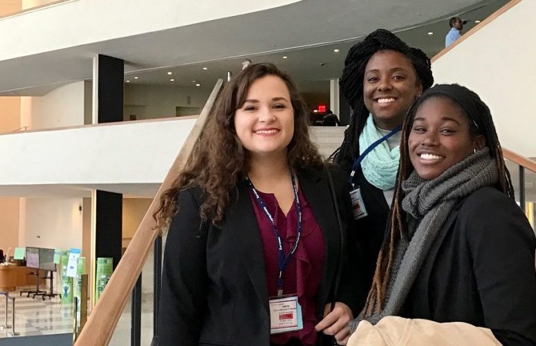 Three students at the closing ceremony