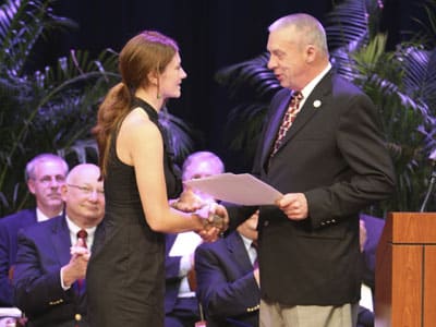 Photo of Jessica Lombardi accepting an award