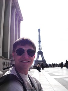 Travis Allen posed with the Eiffel Tower