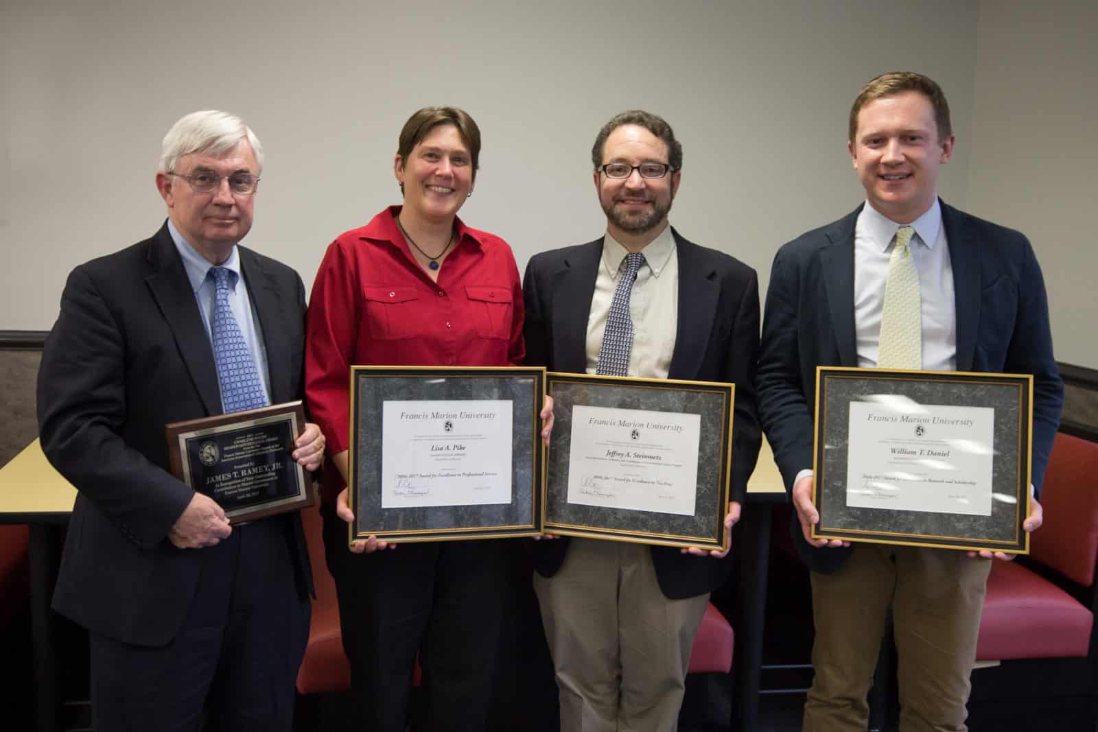 Four FMU professors honored for teaching, service, research, governance