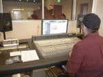 A student manages the sound in the FMU Recording Studio