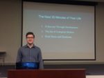 Photo of man standing infront of 30 minutes life powerpoint