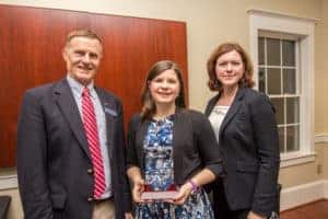 _MG_8205 Elizabeth Howell poses for a photo with faculty members.