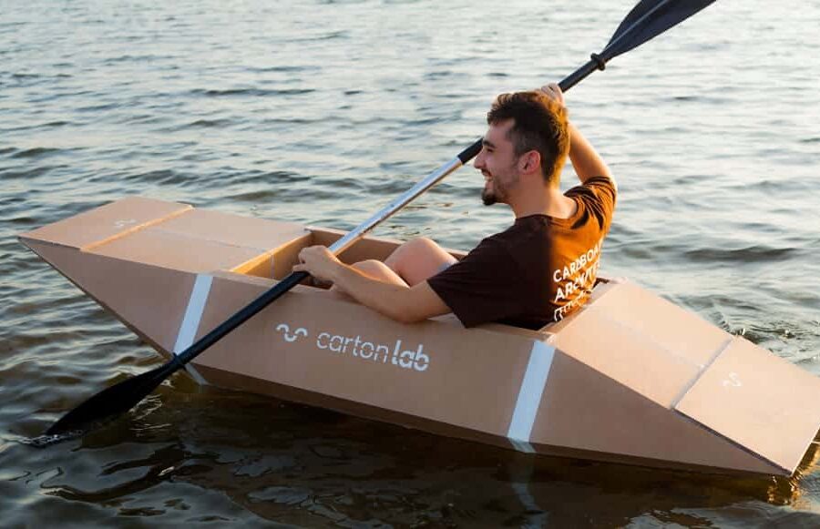 Guy participates in the cardboard boat race