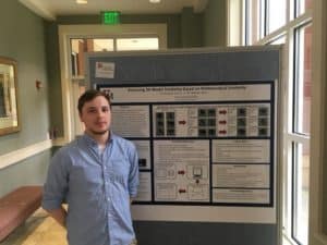 Sousa posed with his research board