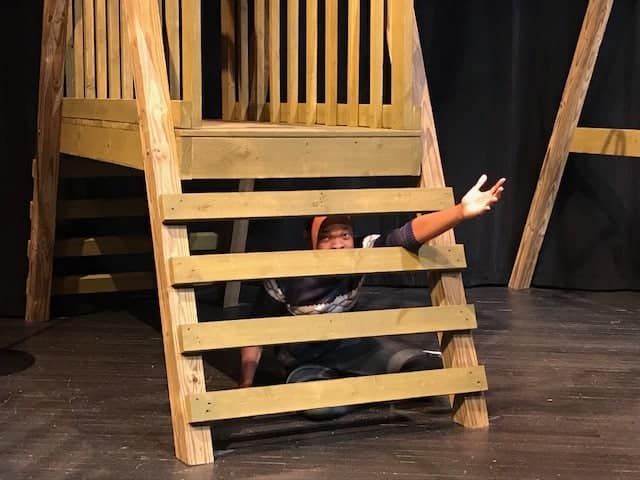 A student performs in the University Theatre production, "The Miser."