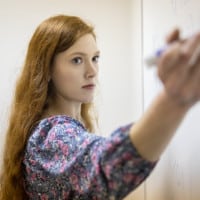 Kaitlyn Lowry solves a math problem.