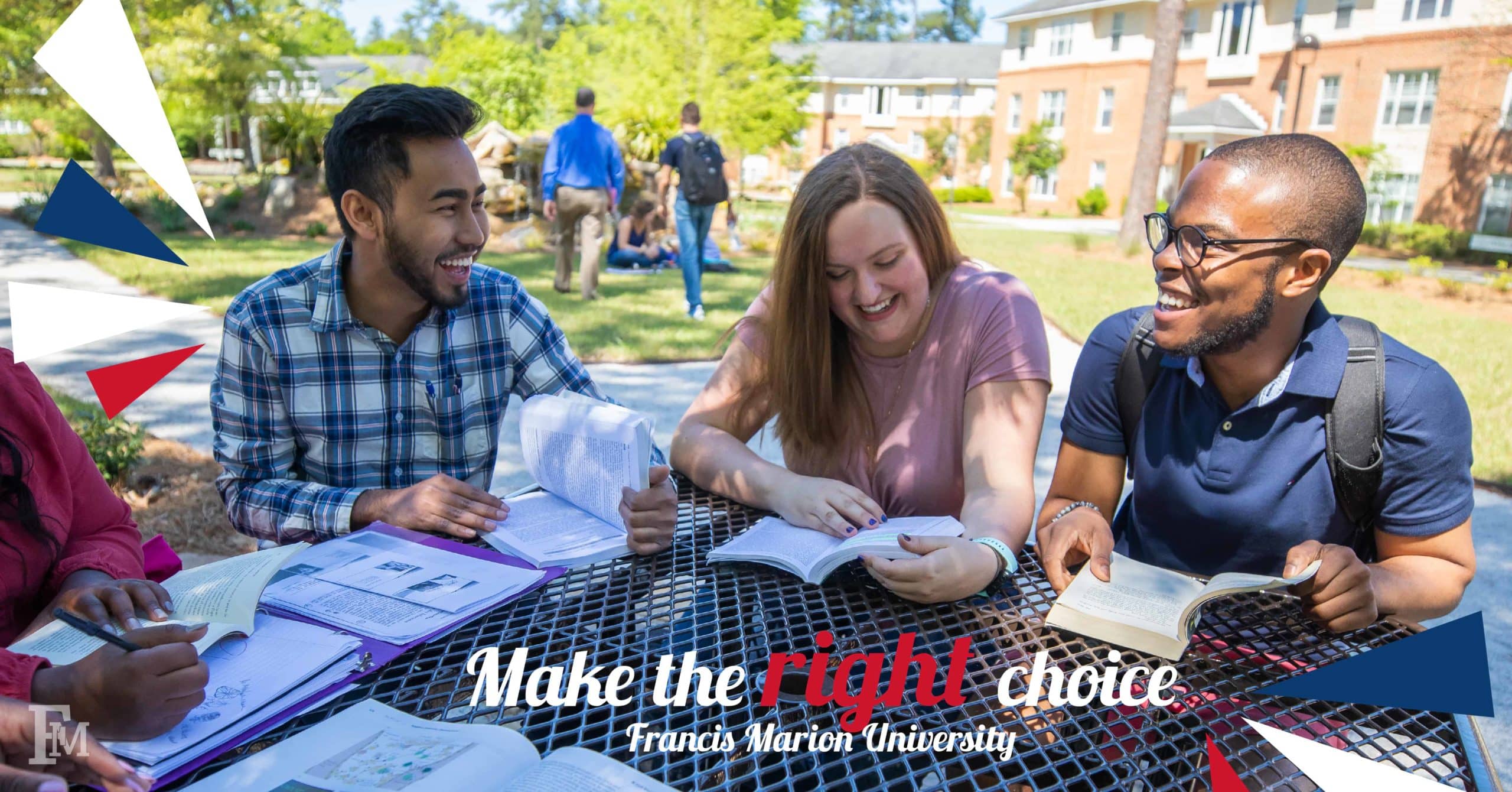 A group of students study together near the Forest Villa apartments.