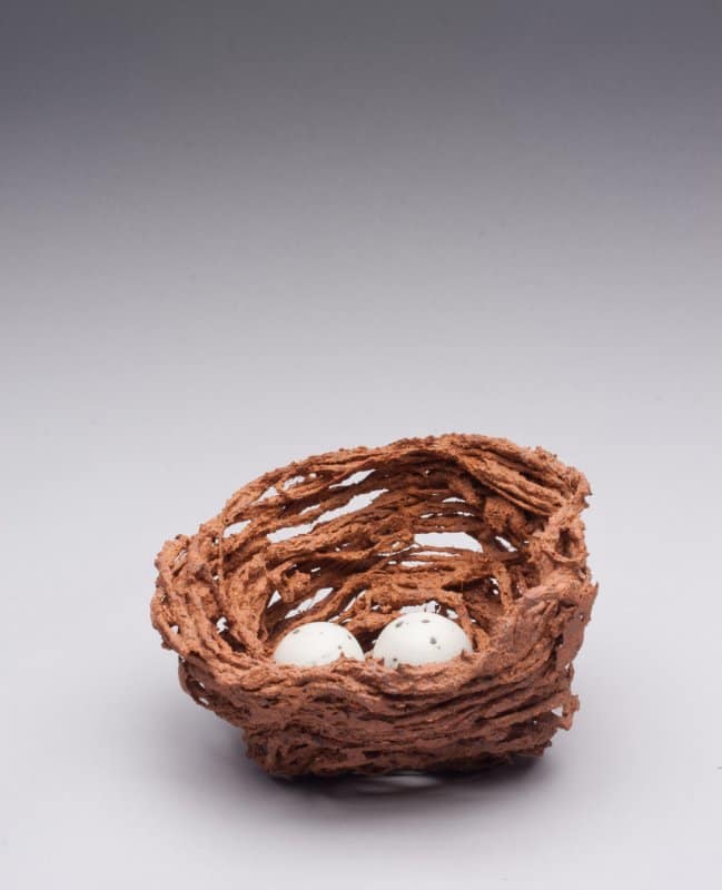 An art piece depicting a nest of eggs.