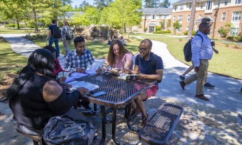 FMU-04162019-Campus-15 Students congregate near the Forest Villa apartments.