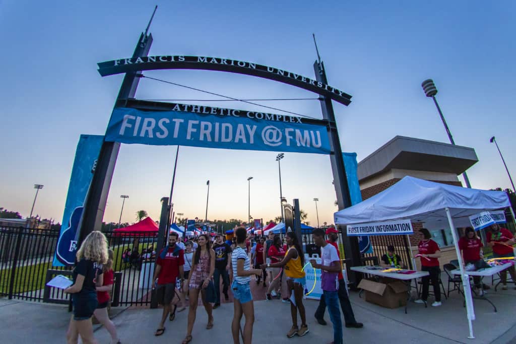 Students gather at the gate to the Griffin Athletic Complex for First Friday.