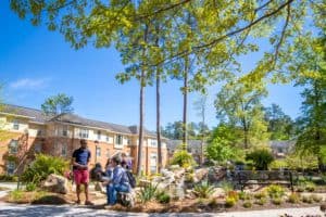 Students gather near the FMU housing area.