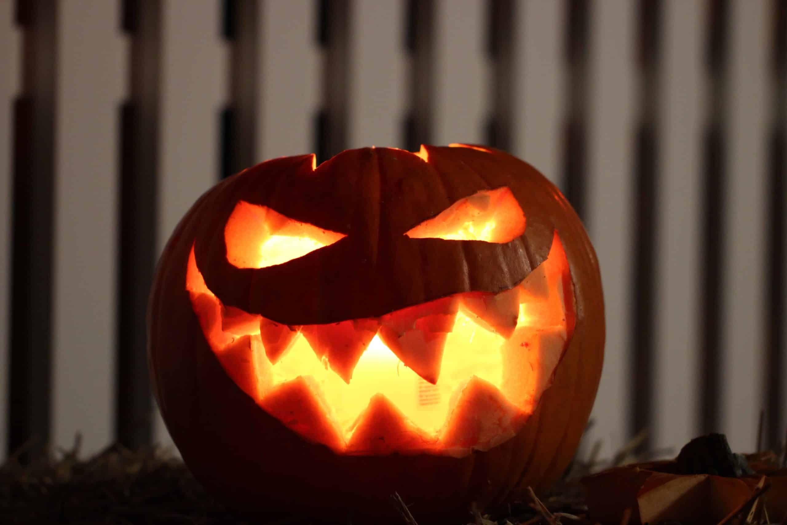 A jack o lantern smiles ominously.