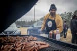 A man grills out during Homecoming at FMU.