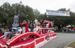 Students jam out on a float during homecoming.