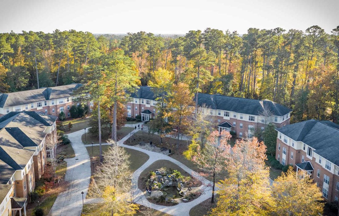 An aerial view of apartments in the evening.