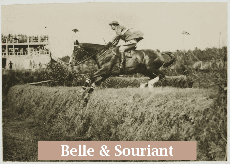 Bell and her horse Souriant leaping down a hill