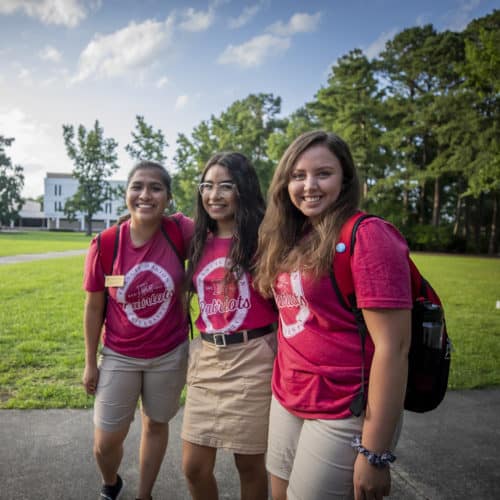 Three students working as orientation leaders.