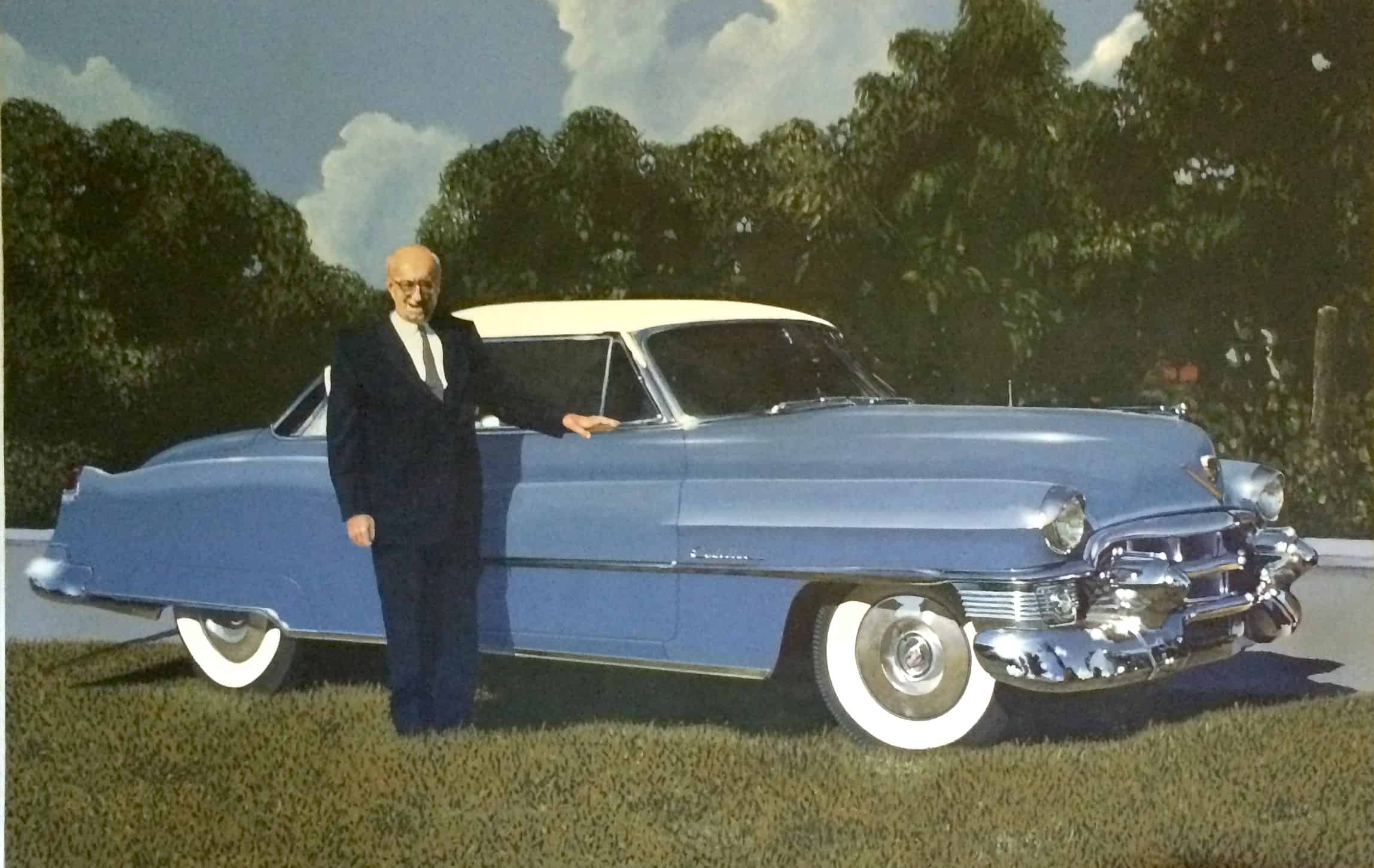 Steve Gately poses in front of his car.
