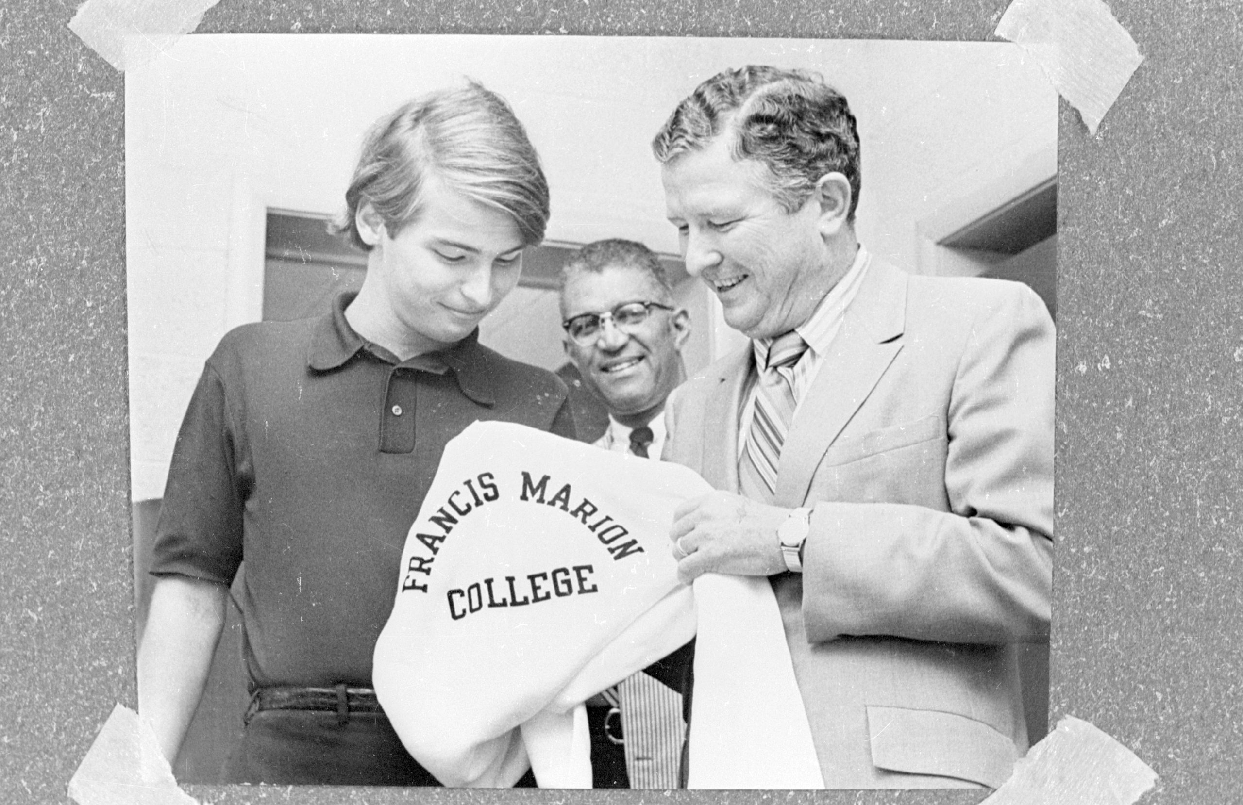 Mcnair with student in front of bookstore at fmu