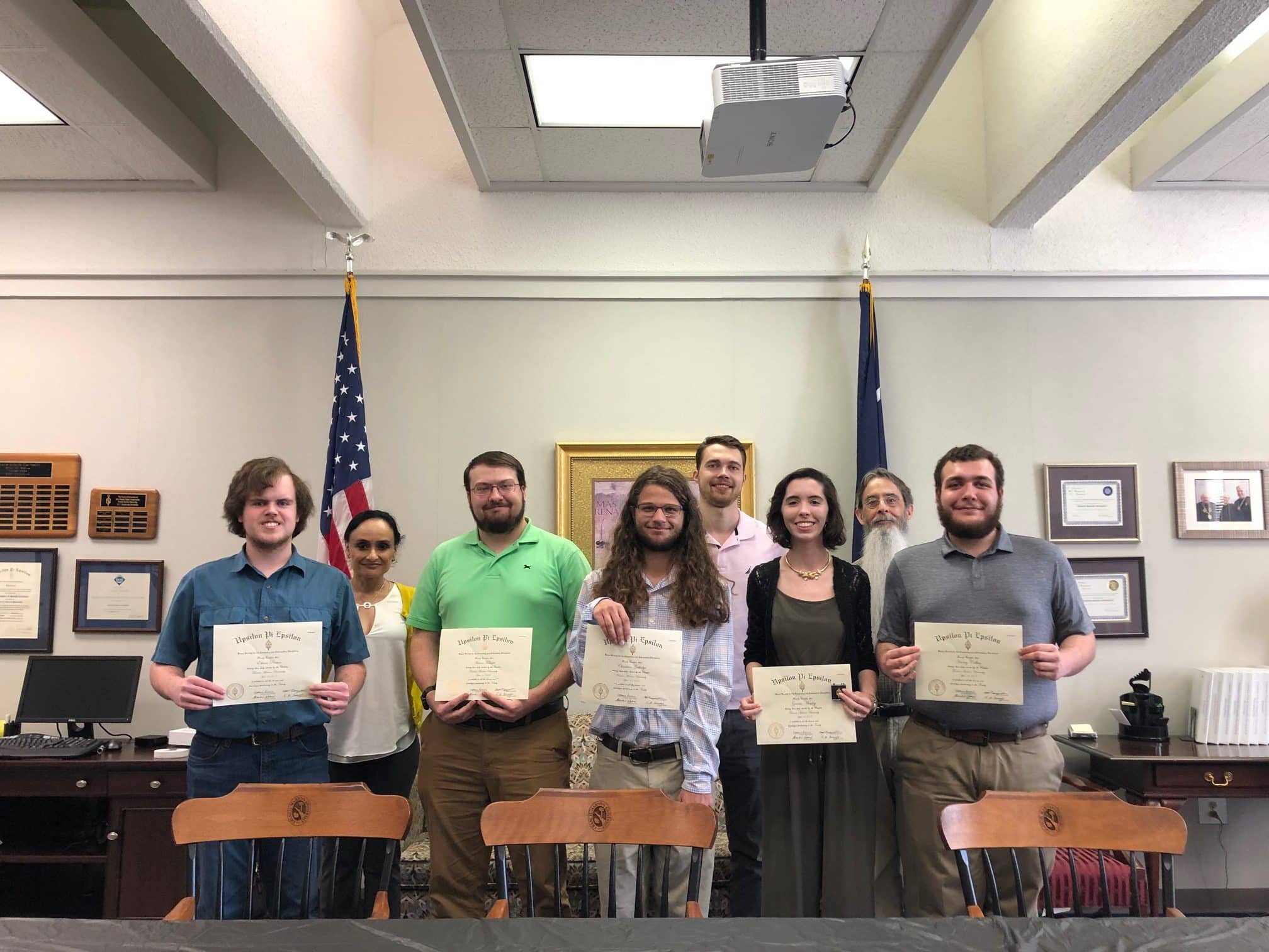 students holding certificates