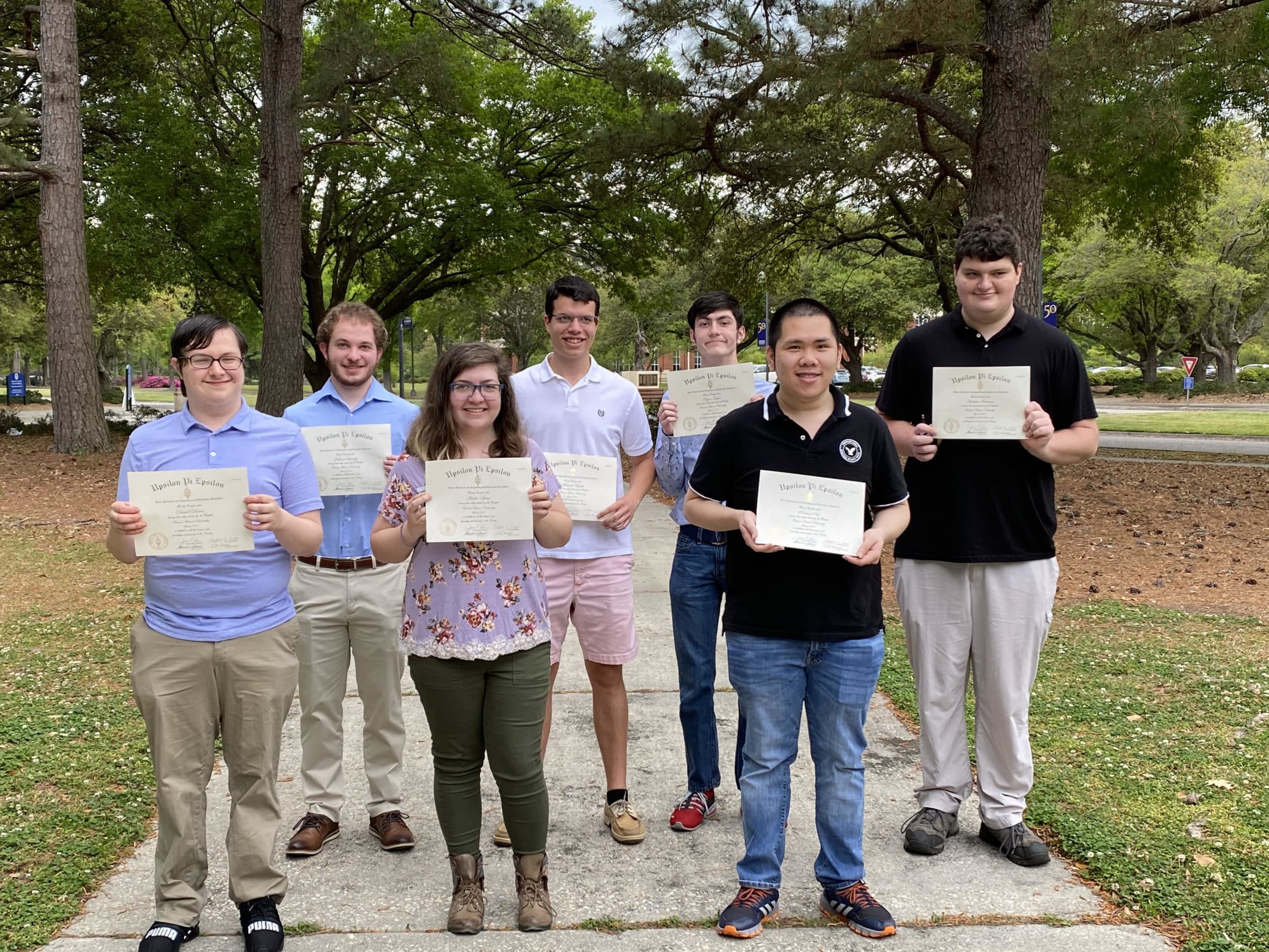 students holding certificates