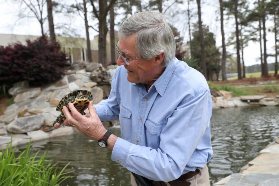 man holding turtle