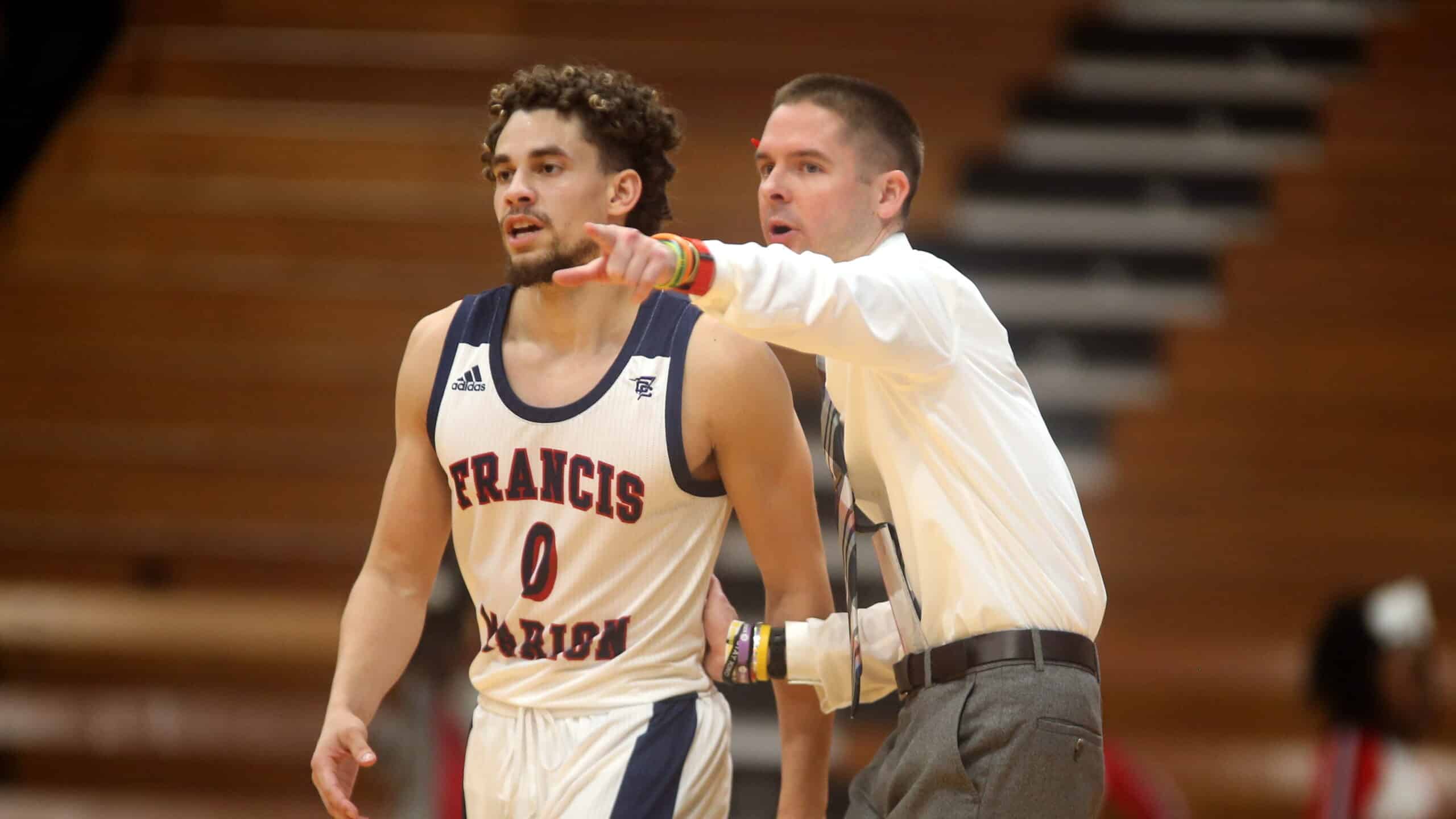 man coaching basketball