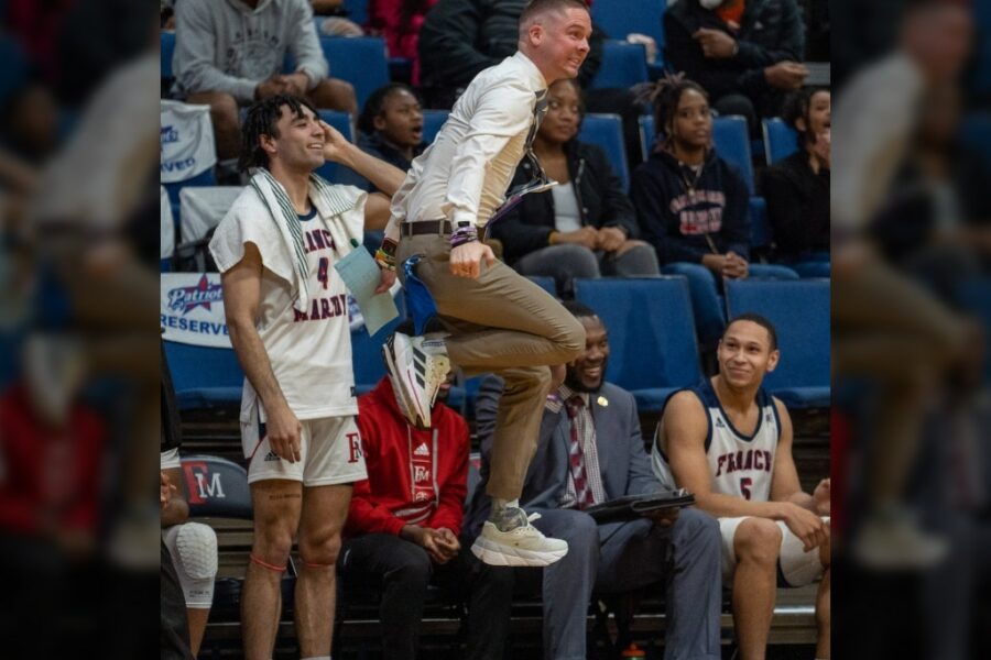 man jumping at basketball game